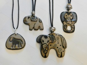 Handmade stoneware elephant pendants on adjustable cord necklaces