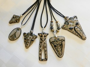 Handmade stoneware elephant pendants on adjustable cord necklaces