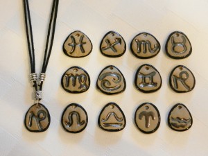 stoneware clay, zodiac pendants, elena calderon handmade jewelry, adjustable cotton cord,