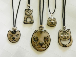 stoneware clay pendants, cat faces, adjustable cotton cord necklaces, elena calderon handmade jewelry